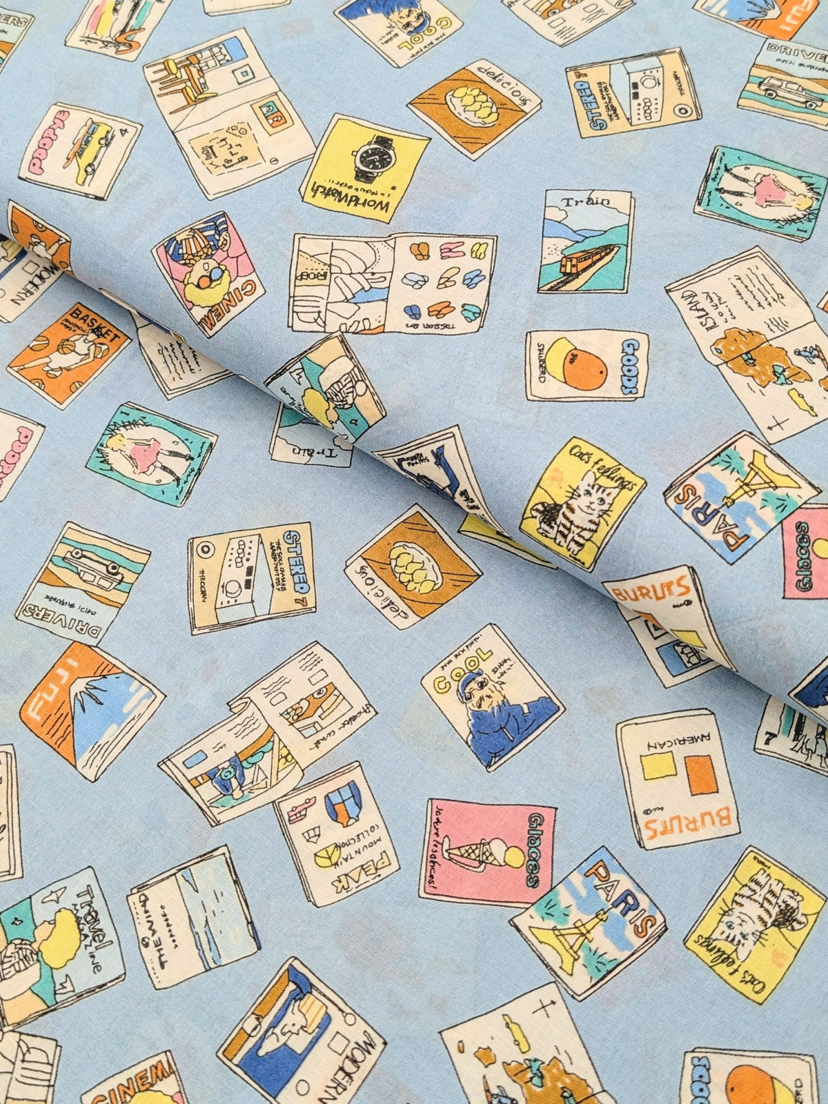 Hokkoh - Retro Magazines Cotton Lawn Fabric - Light Blue