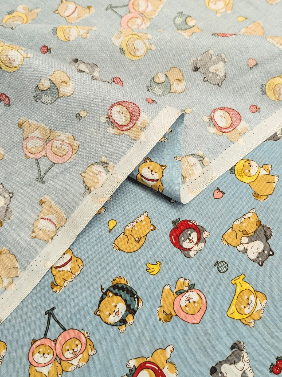 Cosmo - Fruity Shibas Cotton Sheeting Fabric - Light Blue REMNANT