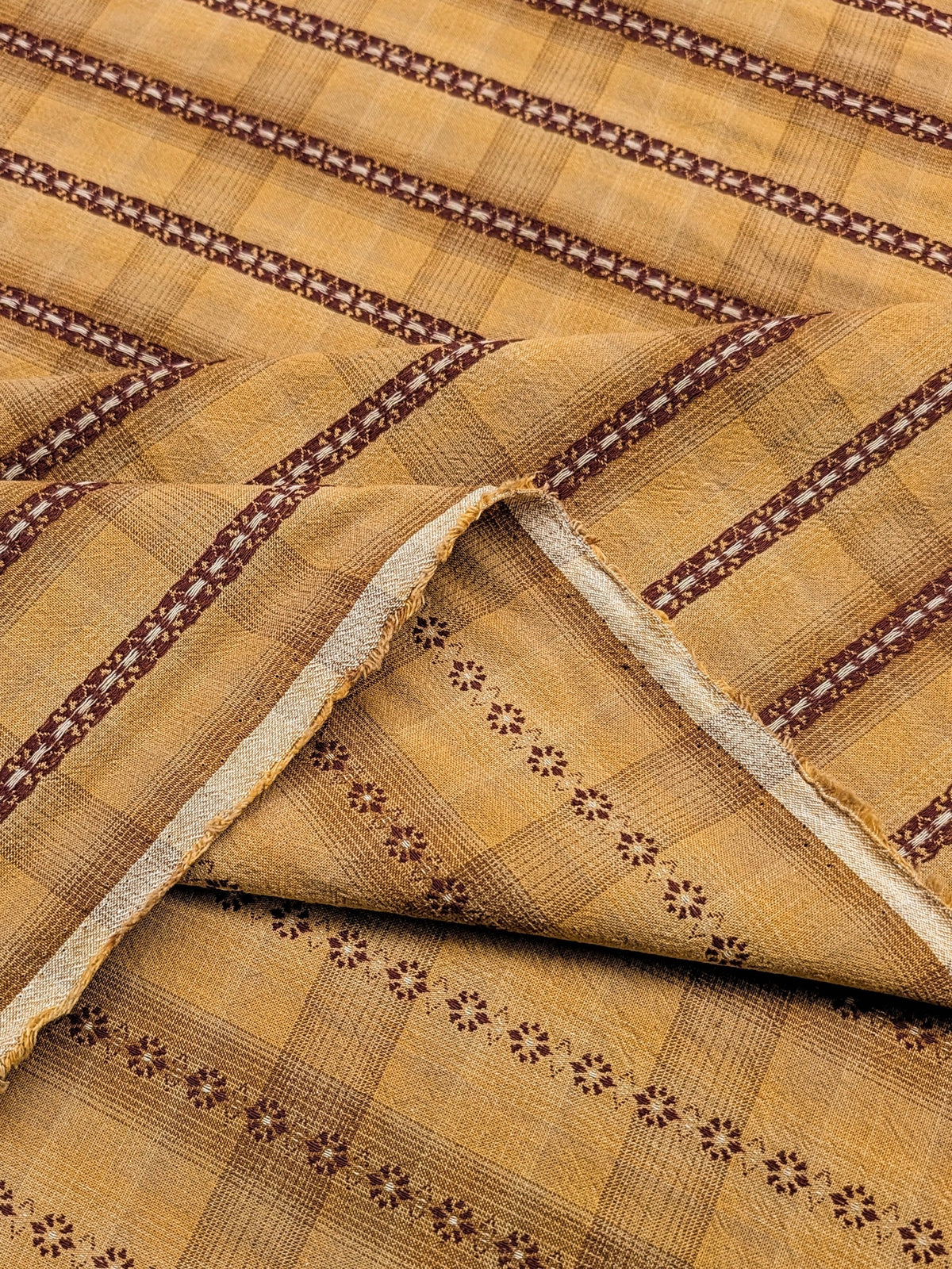 Close-up of patterned fabric with brown and beige colors