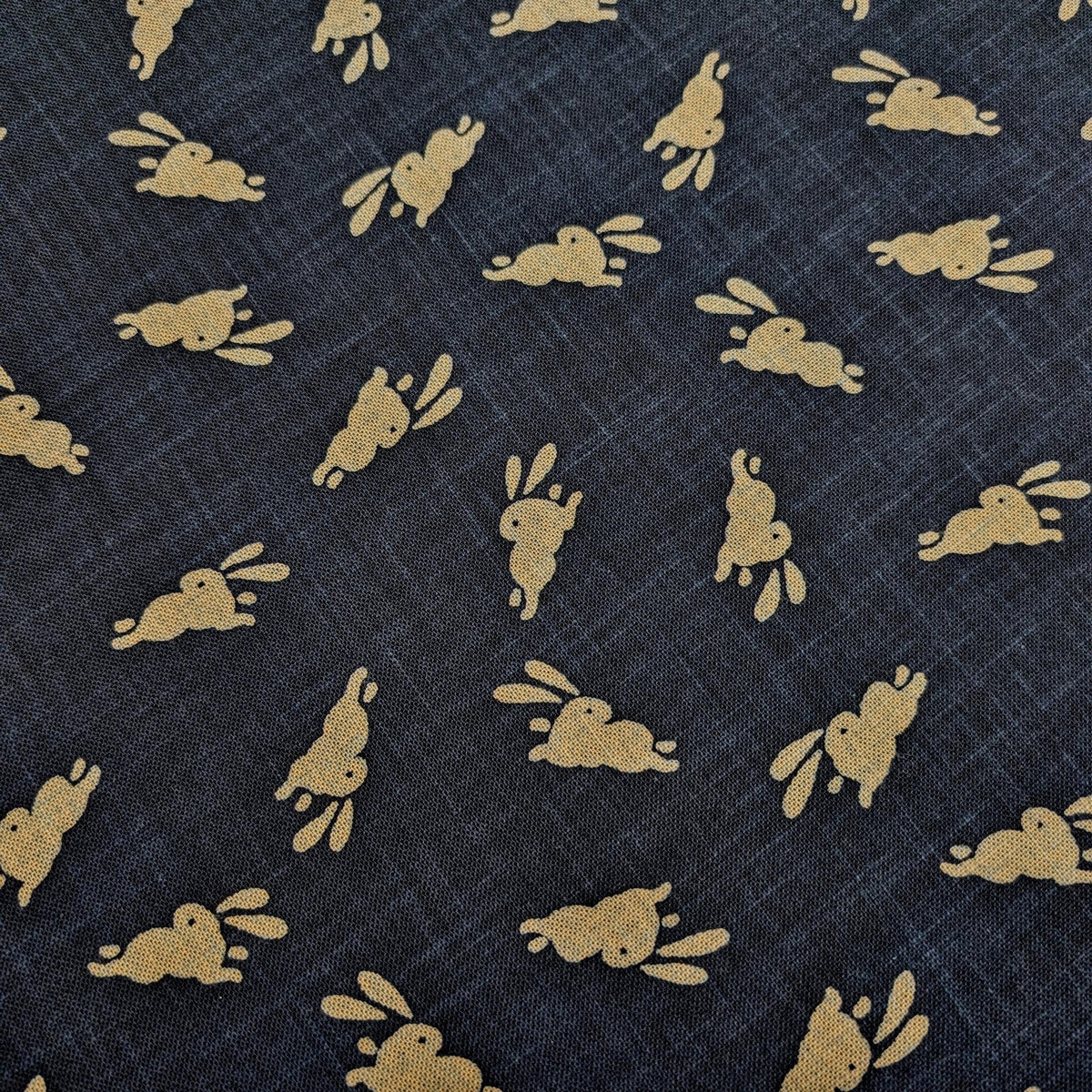 Bouncing Bunnies hand stenciled Japanese cotton fabric KP7090-95 A blue - half yard